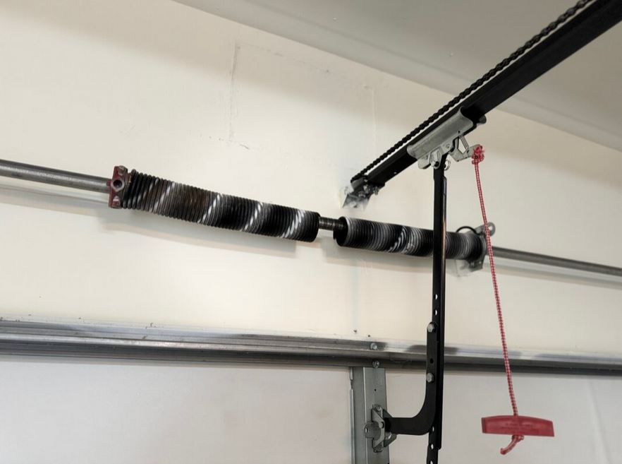 Broken garage door spring causing door not to open